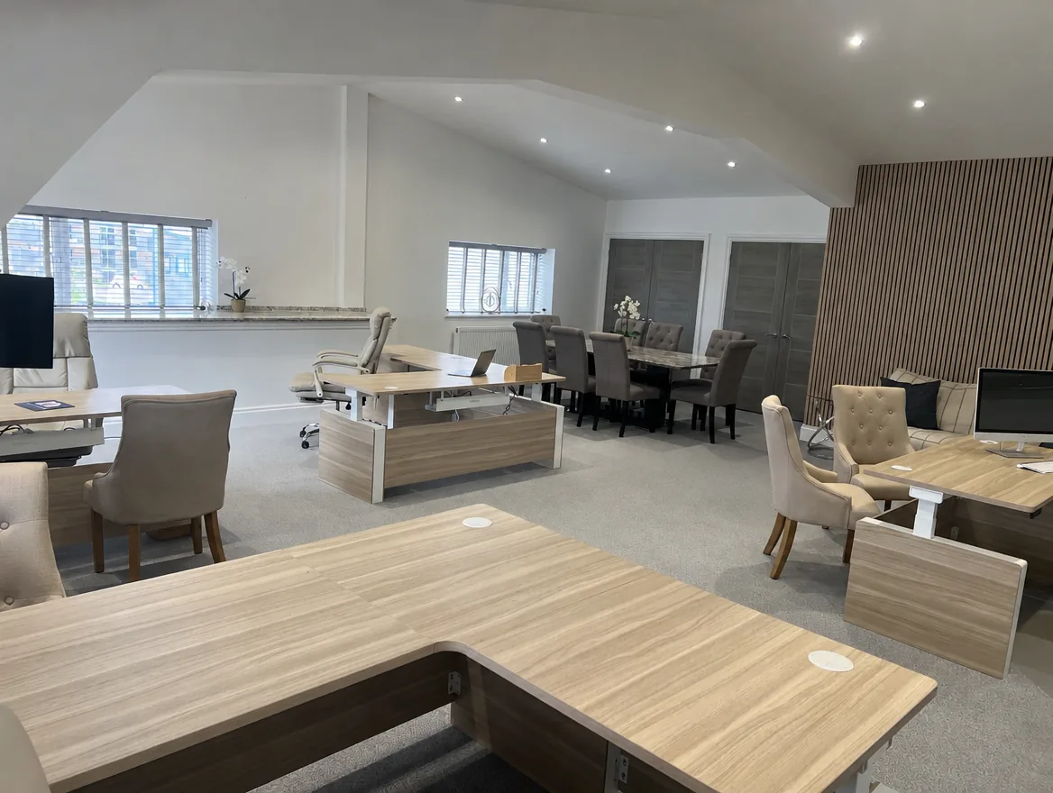 Inside the Appro Digital studio at Manston Business Park, Ramsgate: oak desks, a meeting table and a slatted wood feature wall